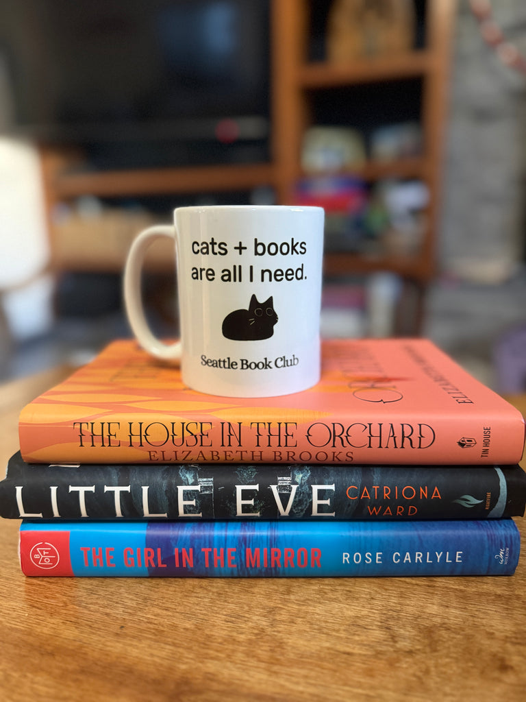 cat mug on a stack of books