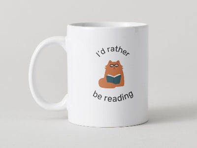 mug with a cat reading a book that says I'd rather be reading